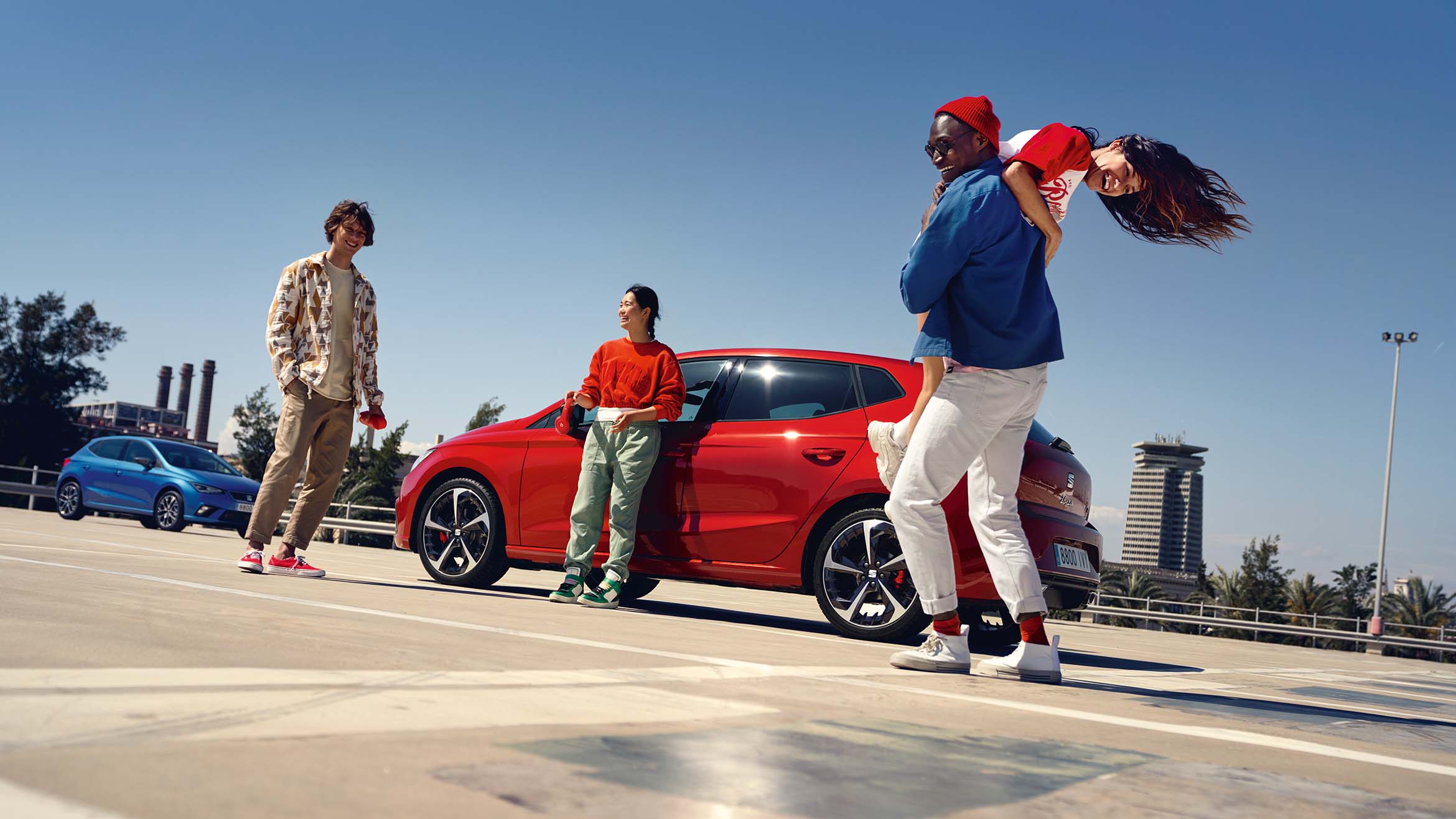 woman leaning on seat ibiza desire red colour watching her friends
