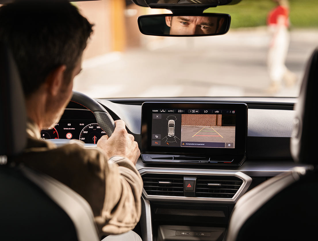 man using park assist with rearview camera